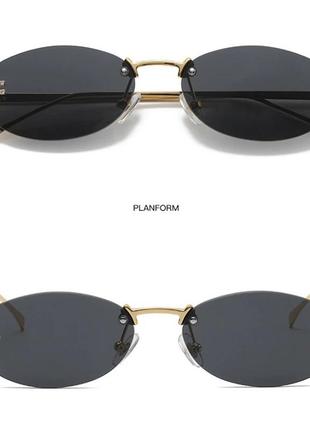 Тренд стильні жіночі чорні овальні сонцезахисні окуляри сонячні очки металева оправа7 фото