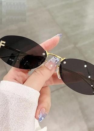 Тренд стильні жіночі чорні овальні сонцезахисні окуляри сонячні очки металева оправа2 фото