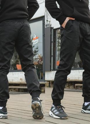 Чоловічі штани карго intruder штани карго з кишенями на манжетах бавовна чорні