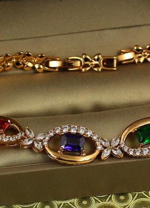 Браслет xuping jewelry силуэт с темными разноцветными камнями  17 см 12 мм золотистый