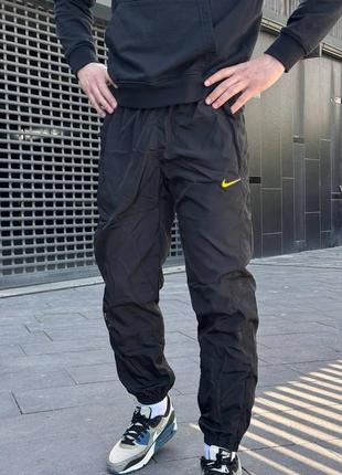 Спортивные штаны мужские черные осенние весенние летние nike x drake notta nrg woven track pants black yellow