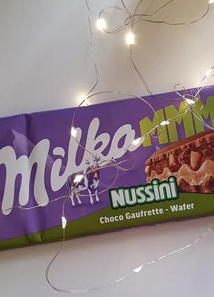 Milka nussini молочный шоколад с рубленым фундуком и вафлями 270 г