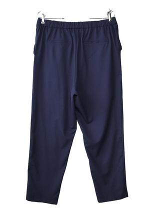 Високі темно-сині брюки з оборками р.202 фото