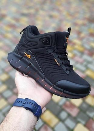 Теплі зимові високі reebok zig kinetica чорні з помаранчевим чоловічі зимові кросівки рибок кінетіка на хутрі