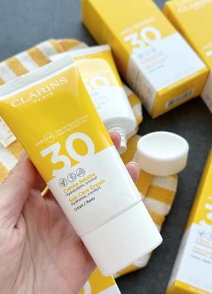 Сонцезахисний крем для тіла clarins solaire corps hydratante