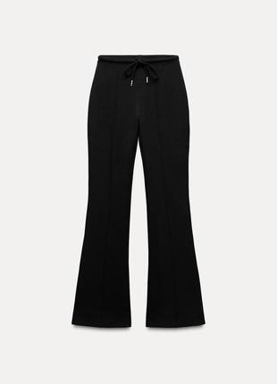 Интерлочные брюки flared с акцентированными швами zara