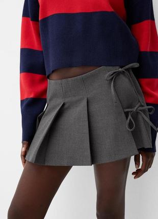 Мініспідниця з бантами bershka