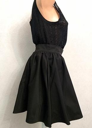 Коротка спідниця з кишенями