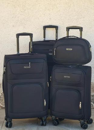 Большой  размер  чемодана wings  6018 black  на спаренных колесах