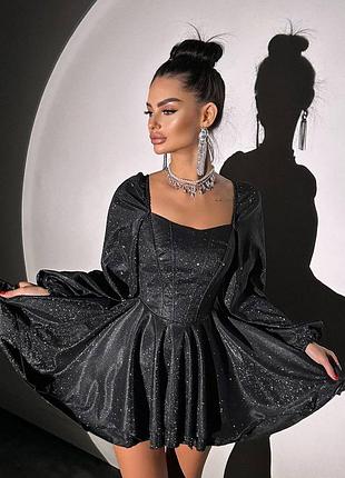 Сяюча корсетна сукня з пишною подвійною спідницею та об‘ємними рукавами