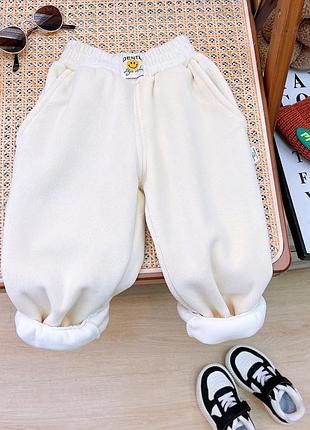 Дитячі зимові вельветові штани на флісі молочні