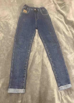 Теплые джинсы на девочку синие