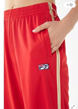 Стильные яркие спортивные штаны бренда fila в калобарации с pieree carbin4 фото