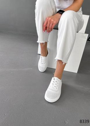 Білі натуральні шкіряні кросівки кеди з наскрізною перфорацією шкіра10 фото