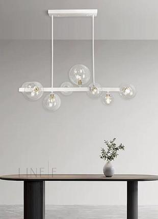 Видовжена біла люстра-молекула на 8 прозорих плафонів 75 см