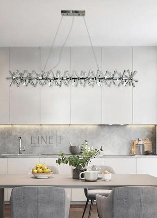 Видовжена срібна дизайнерська люстра alma з кристалами