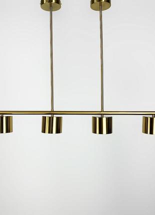Видовжена латунна люстра clyde з 4-ма спотами