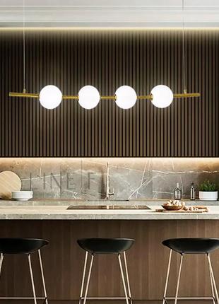 Видовжена латунна люстра з 4-ма акриловими кульками