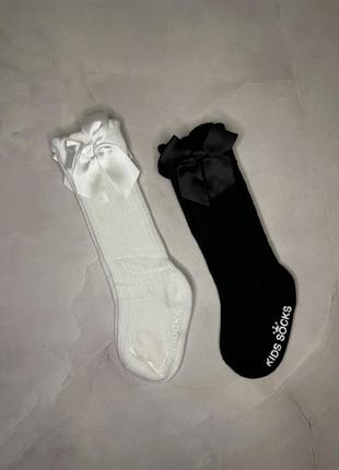 Дитячі гольфи високі шкарпетки з бантиком ошатні на дівчинку чорні білі