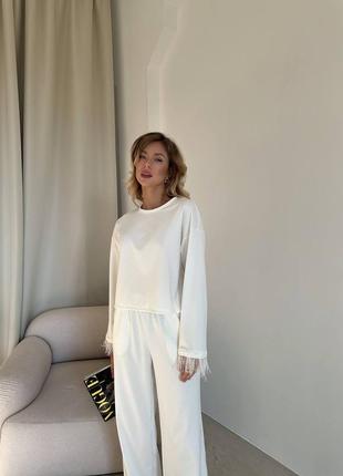 Женские костюмчики с сораусиными перьями