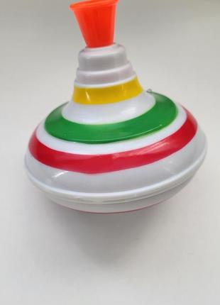 Юла. волчок. музыкальная игрушка. игрушка со светом и звуком.