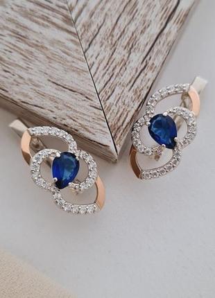 Серьги из серебра с золотыми напайками синими и белыми цирконами