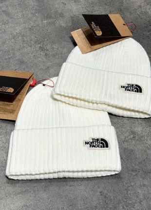 Топові шапки від бренду the north face у двох кольорах