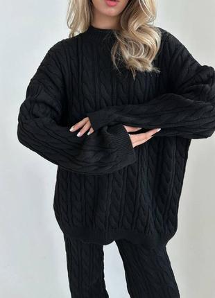 Жіночий теплий в'язаний костюм в косичку з вовною оверсайз, штани кльош на високій посадці