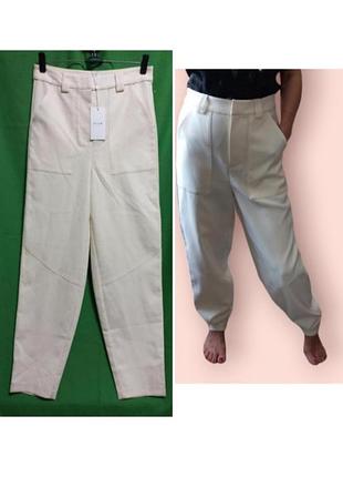 Кремовые брюки с накладными карманами vila