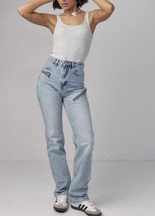 Стильні джинси з замками на стегнах1 фото