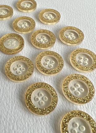 Ґудзик костюмний блискучий бортик 4отв золотий 20мм пластик