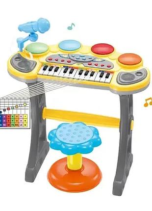 Синтезатор-піаніно дитячий зі стільчиком (24 мелодії) 6634a
