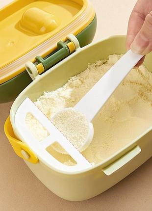 Контейнер для зберігання дитячої сухої суміші 800 мл з мірною ложечкою динозавр світло зелений