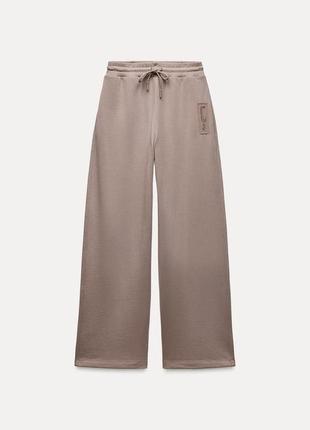 Плюшеві штани з етикеткою zara