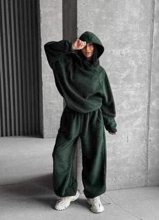Теплий спортивний костюм оверсайз з худі з капюшоном з резинкою на рукавах з затяжками по боках з штанами з кишенями з затяжками з низу