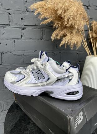 Кросівки білі жіночі new balance 5306 фото