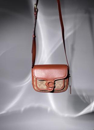 Жіноча сумка в стилі coach tabby messenger in signature canvas premium.10 фото