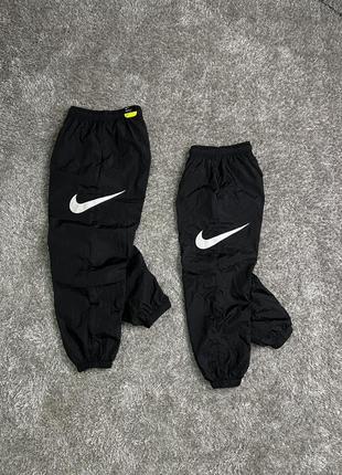 Nike nylon pants side swoosh1 фото