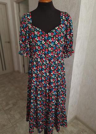 Квіткова сукня міді  з об'ємним рукавом та відкритою спинкою !