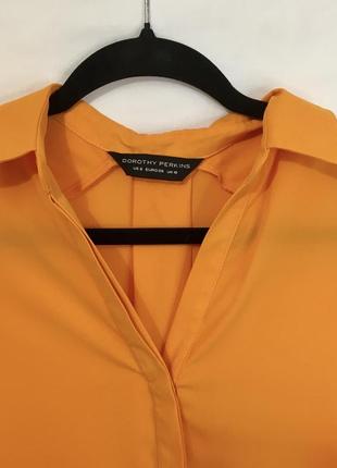 Оранжевая блуза без рукавов с длинной спинкой3 фото