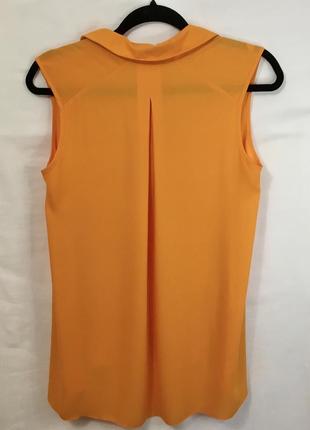 Оранжевая блуза без рукавов с длинной спинкой7 фото
