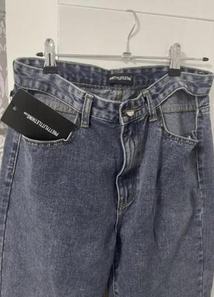 Шикарні нові  джинси з розрізами розмір м5 фото