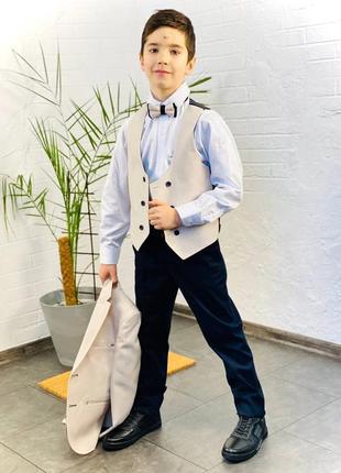Стильный костюм хорошего качества на мальчика пиджак, рубашка, жилетка, бабочка и стильные брюки.5 фото