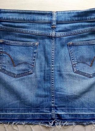 Юбка джинсовая на пуговицах, рваный низ, край.3 фото