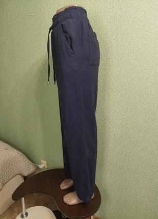 Льняные брюки свободного прямого кроя на резинке6 фото