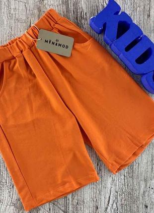 Классические шорты оранжевого цвета1 фото