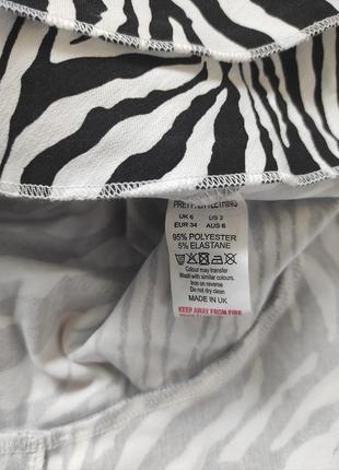 Трендовая мини-юбка из эластичной ткани с принтом зебры и оборками спереди

посадка высокая10 фото