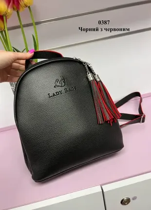 Чорна з червоним усередині — стильна сумка-рюкзак lady bags на два відділення на блискавці, з китицями