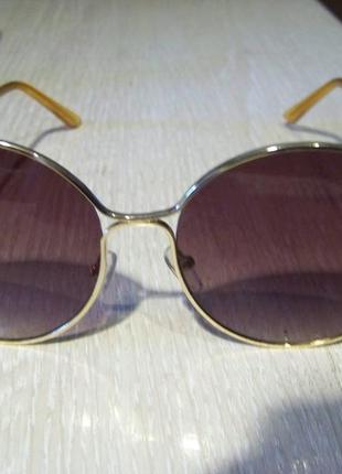 Крупные круглые солнцезащитные очки с золотой оправой и линзой винный градиент6 фото