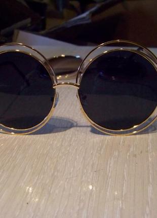 Великі круглі сонцезахисні окуляри чорні в золотій оправі3 фото